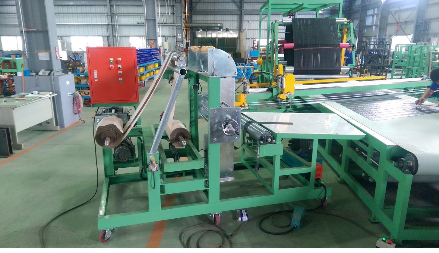 Bias cutter conveyor bed and cutting beam, viewed along the machine
