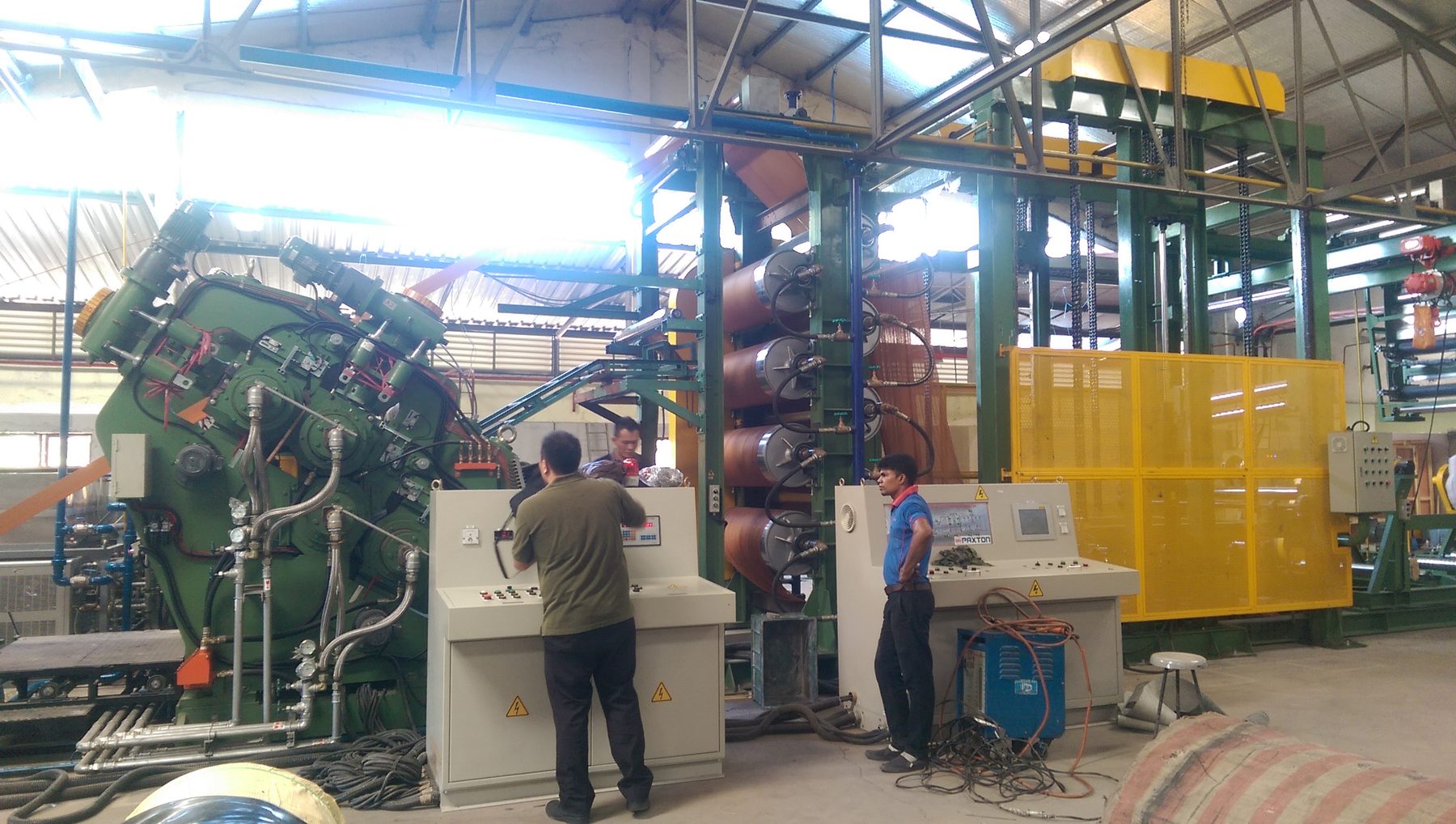 Complete calendering line: calender, cooling drums and fabric accumulator