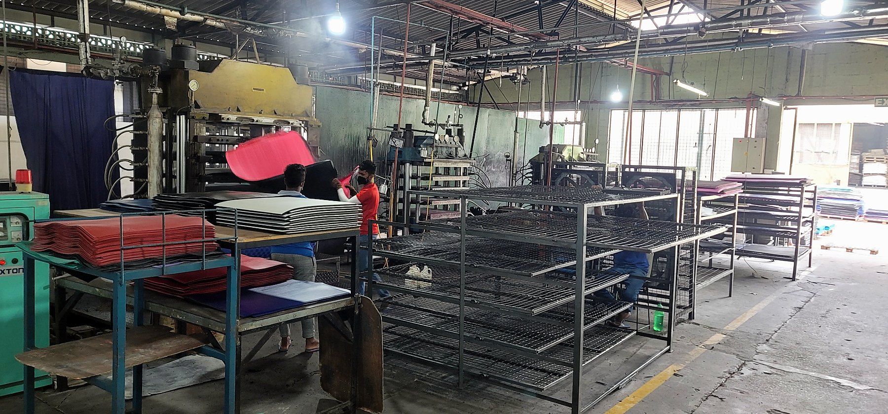 EVA sheet production area with presses, sheet stock and handling racks