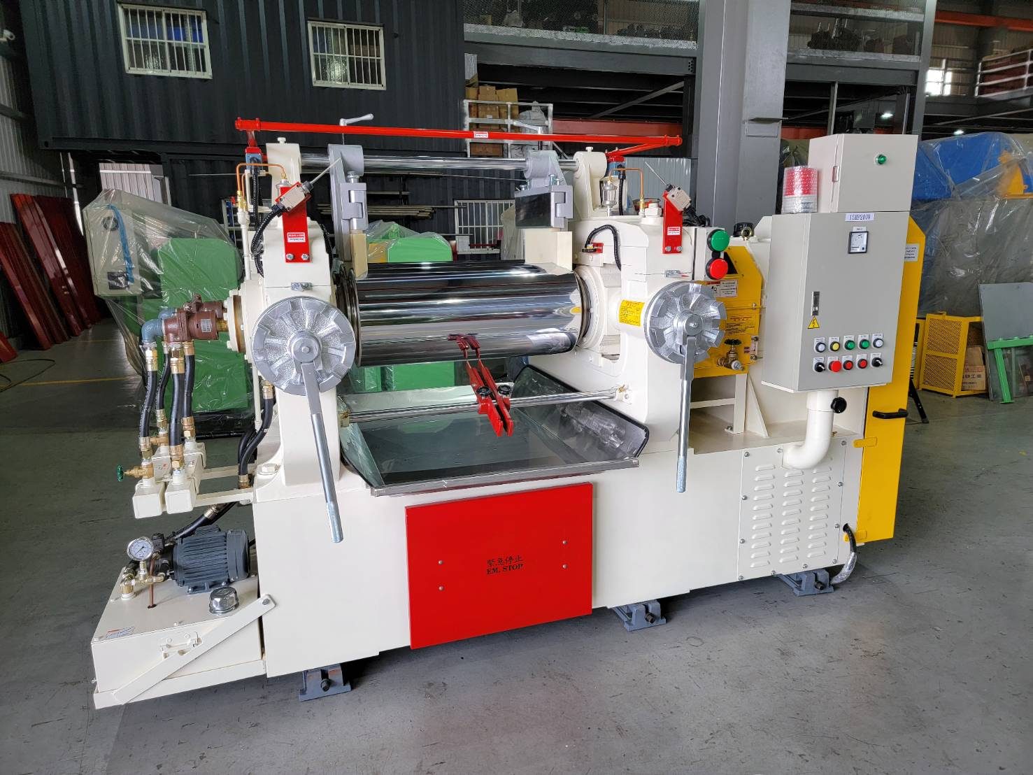 Two-roll open mixing mill with safety trip bar and operator controls