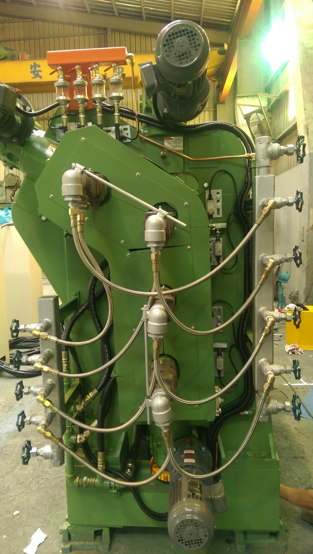 Side frame detail: lubrication points, roll bearing feeds and drive motor